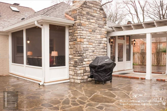 beautiful stone patio with screened porch