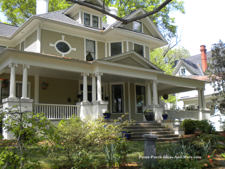 large traditional porch with stone pedestals