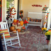 wonderfully decorated front porch for fall