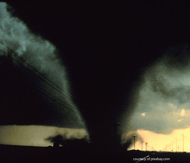 tornado touching down with car in front