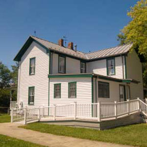 wheelchair ramp attached to farmhouse porch and home