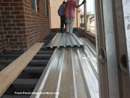 concrete porch steel poured metal floor corrugated sheathing channels pans deck construction foundations footing framing installed being roofing overlap putting
