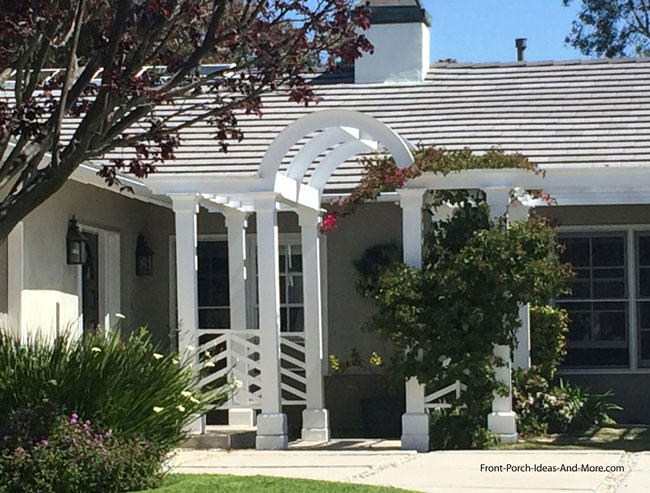 Arched front porch pergola on home
