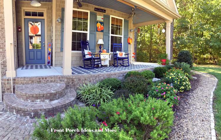 our front porch decorated for fall with pumpkins