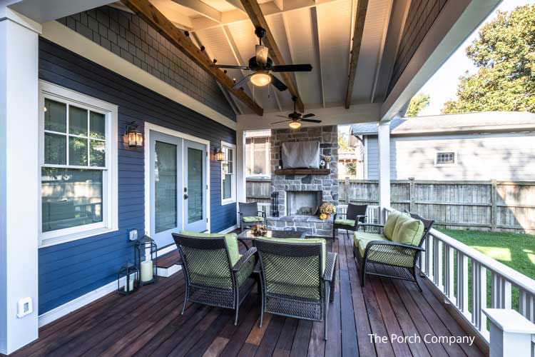 Custom back porch with fireplace by the Porch Company
