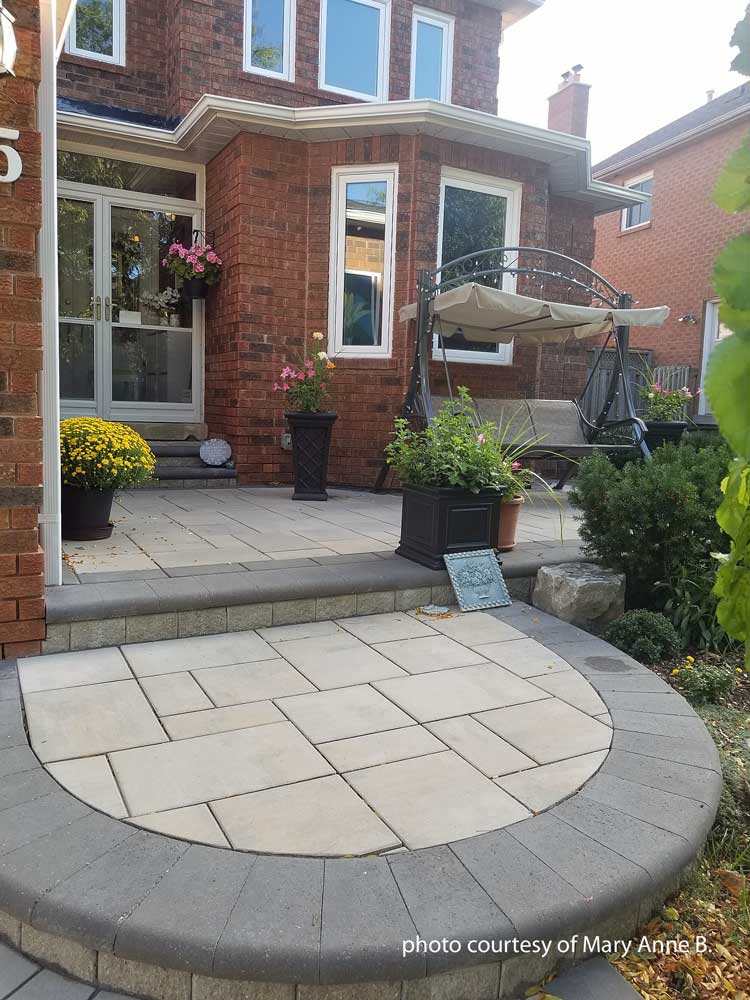 nicely designed patio porch on brick home