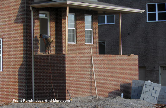 brick front porch before building concrete steps