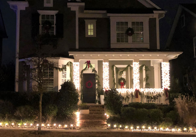 outdoor Christmas lights covering front porch columns
