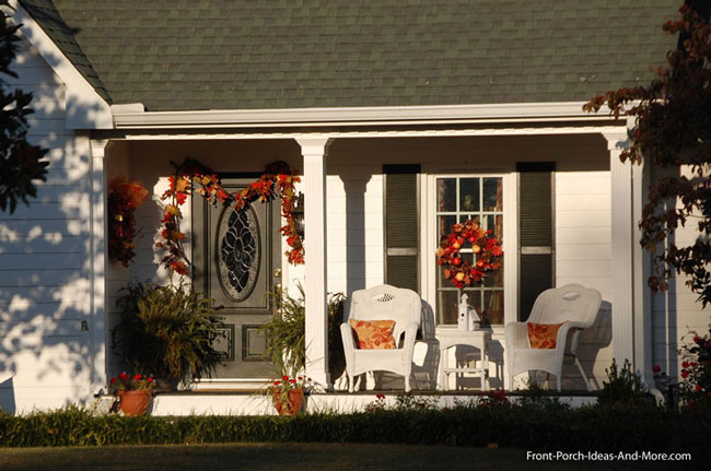 classic autumn leaf displays on front porch