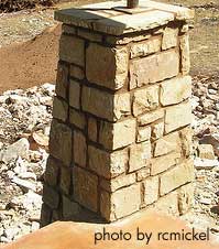 a stone column being built