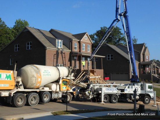 concrete truck delivering concrete to the concrete pumping truck