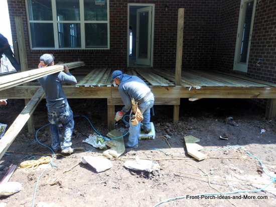 deck boards being laid over joists
