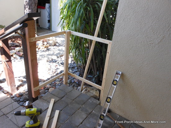 picket fence frame attached to 2x4 and secured in the ground