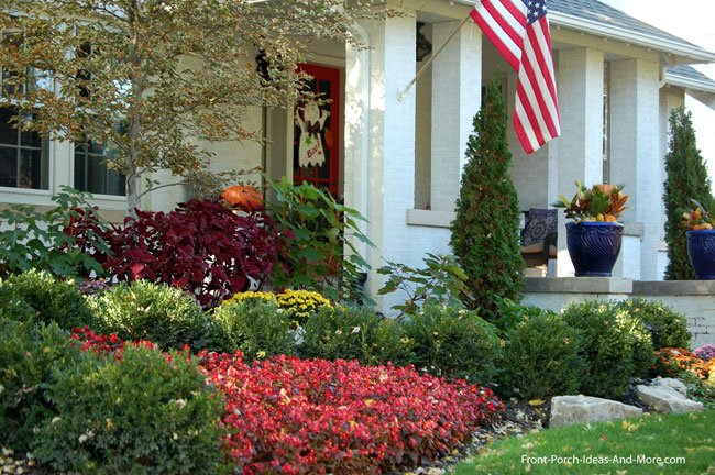 fall foliage in front of front porch