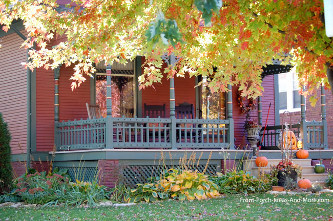 farmhouse front porch in autumn