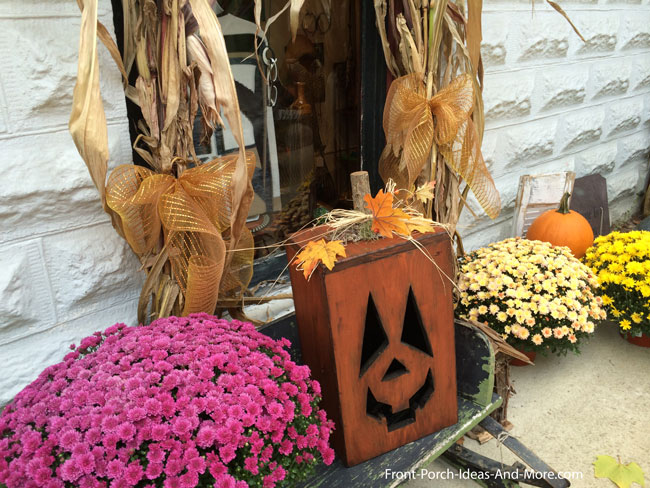 whimsical fall display on front porch