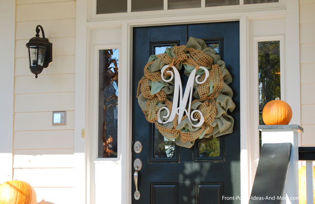 autumn wreath on front door with initial m