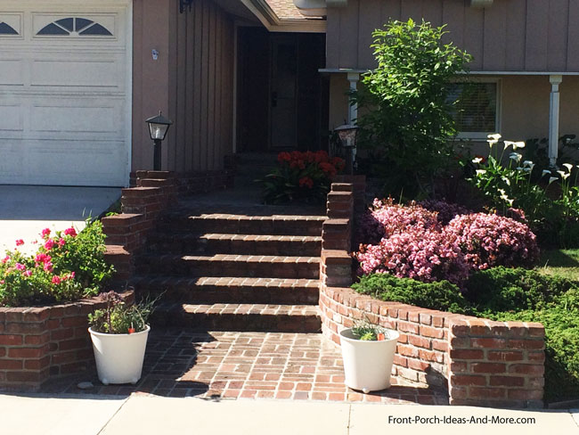 a formal brick walkway to front porch