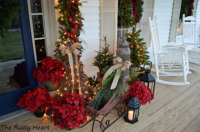 wonderful front porch holiday display by the rusty heart