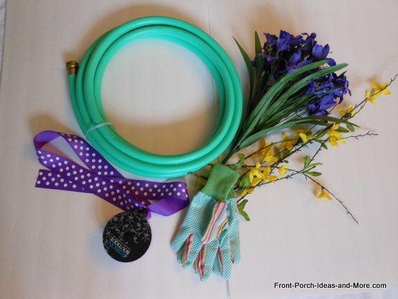 Our garden hose wreath is from last year but with new polka dot ribbon and new spring flowers