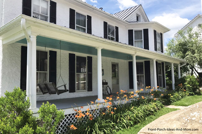 haint blue porch ceiling on two story home