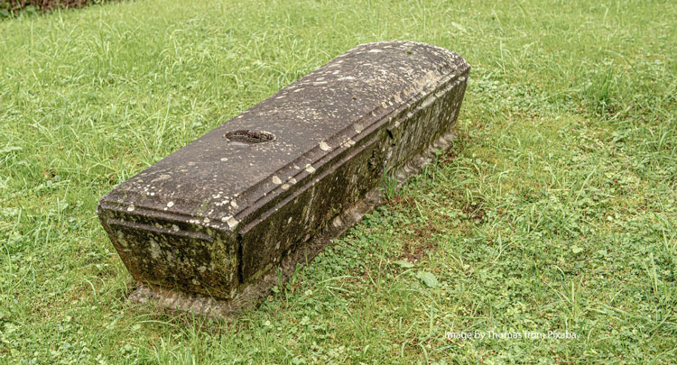 coffin in graveyard