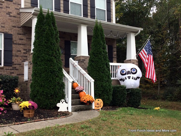 Halloween porch with large inflatable skeleton head