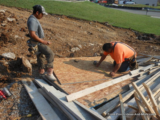 laying out the stringers for the concrete steps on plywood form