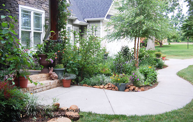 meandering concrete walkway to front porch