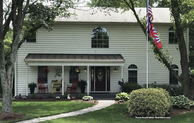 metal front porch roof on two story home