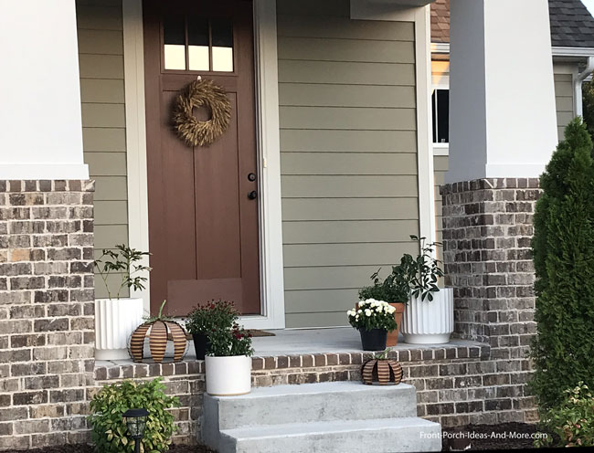 metal pumpkin decorations on front porch
