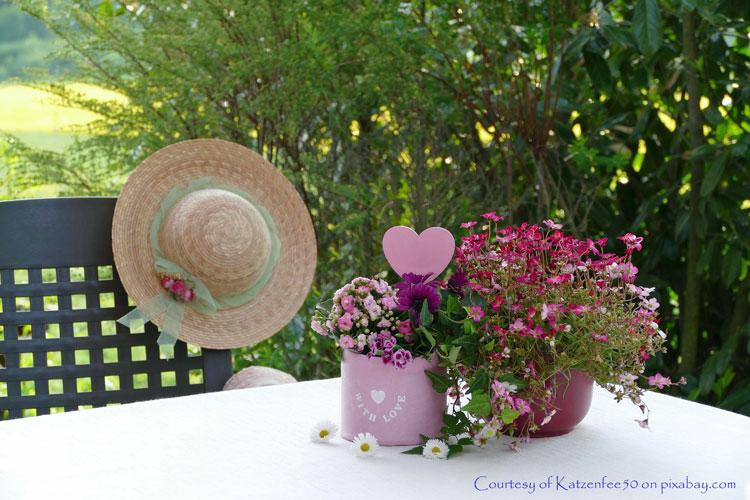 Sunbonnet and flowers on table for Mothers Day