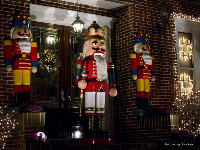 two large nutcrackers guarding the front door at Christmas