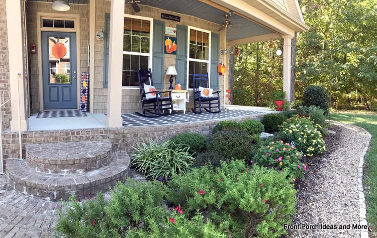 Our fall porch is decorated with an autumn pumpkin theme