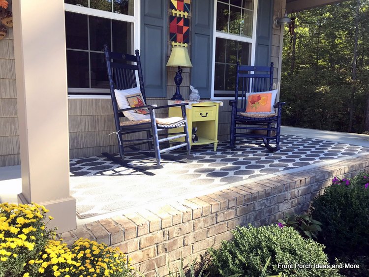 our autumn porch decorated with mums and pillow toppers