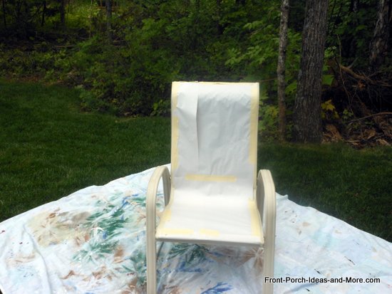 put the chair out in the open on a protective sheet or large piece of plastic to protect the area in which you are painting