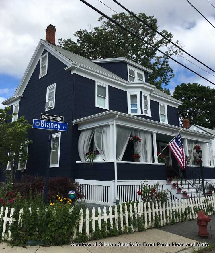 wispy outdoor porch curtains blowing in the breeze
