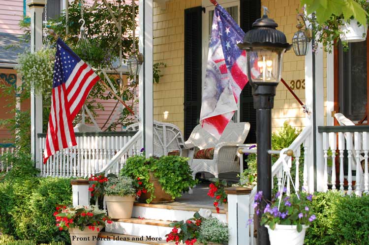 hanging baskets of flowers on front porch