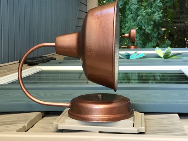 farmhouse style porch light painted in copper