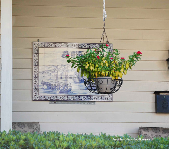 outdoor wall art on front porch