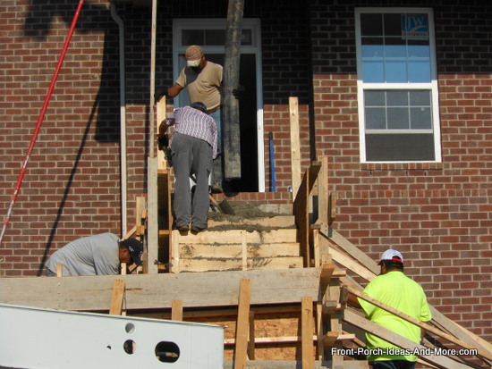 concrete being poured at the top of the steps