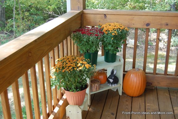 Porch display stands that Dave made with our grandchildren for just a few bucks