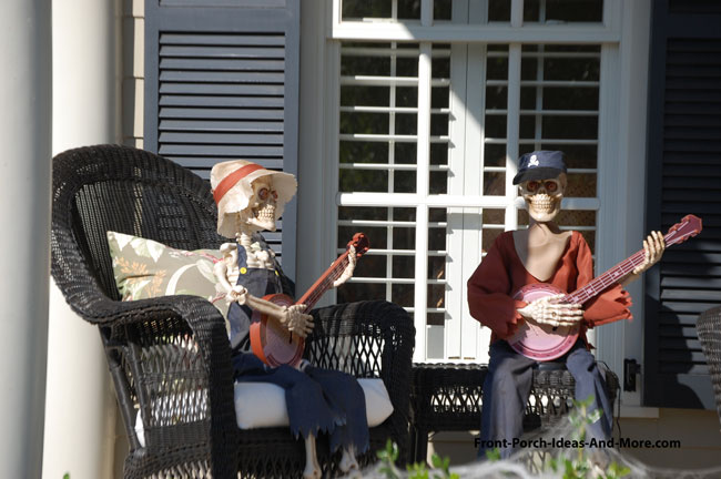 skeleton banjo players on front porch