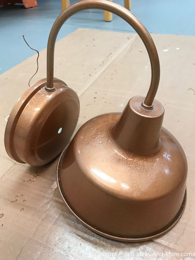 porch light spray painted with copper paint