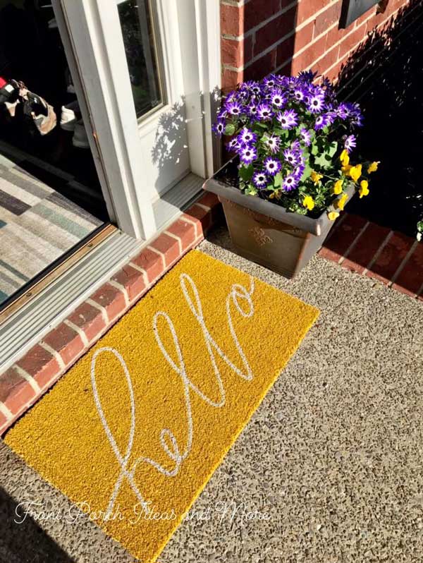 Happy front doormat in yellow that says hello