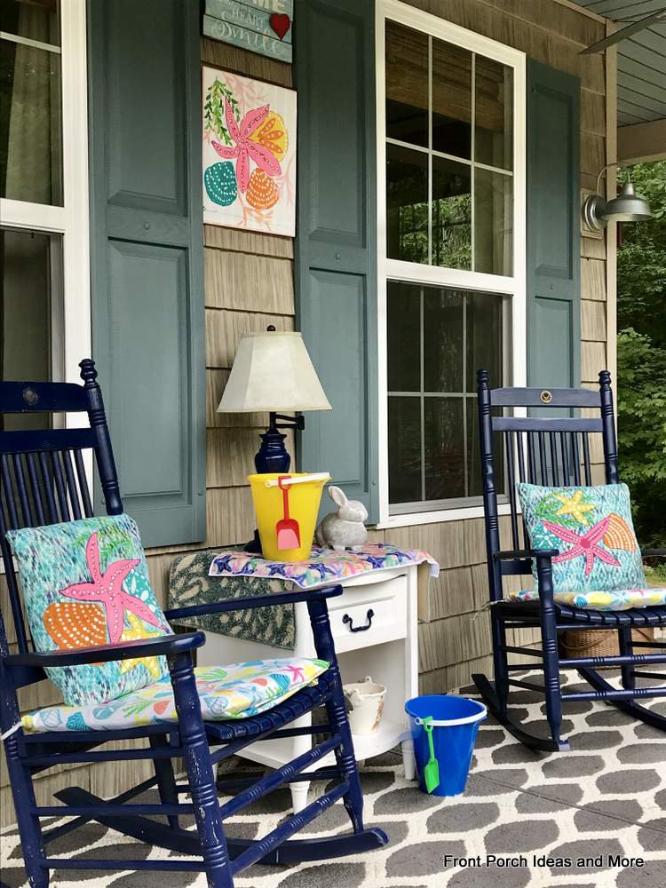 Summery beach cushions and shells painted on pillows