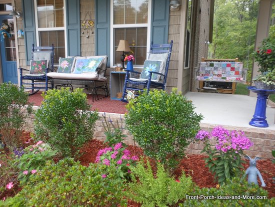 Our summer porch with our cheerful pillow toppers