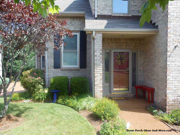two story home with small front porch 