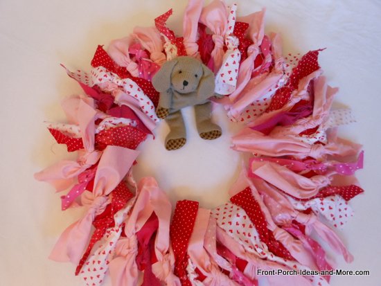 Pink and red valentine wreath craft all done with little dog in the middle