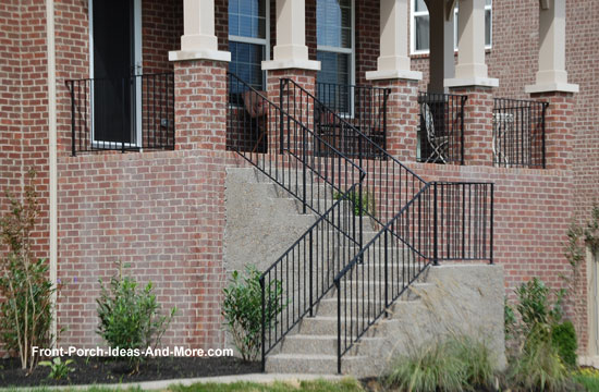 finished concrete porch steps with wrought iron railings
